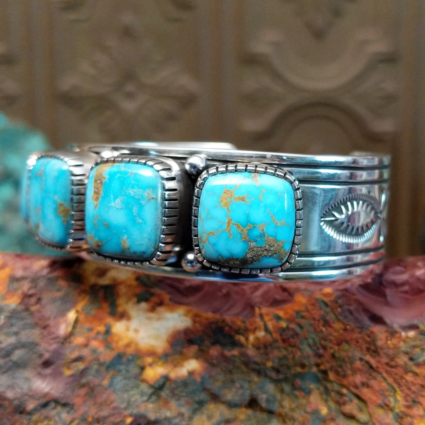 Sterling silver cuff featuring Sonoran gold turquoise set in square, etched bezels. 