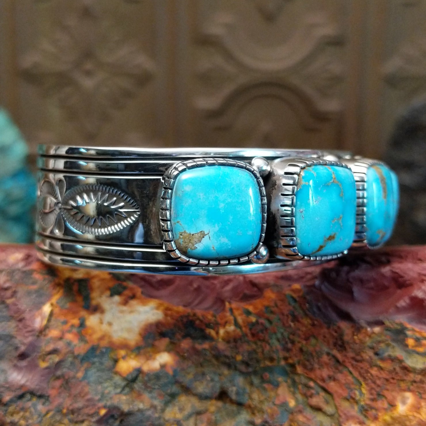Sterling silver cuff featuring Sonoran gold turquoise set in square, etched bezels. 
