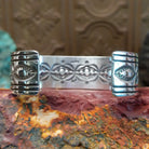 Sterling silver cuff featuring Sonoran gold turquoise set in square, etched bezels. 