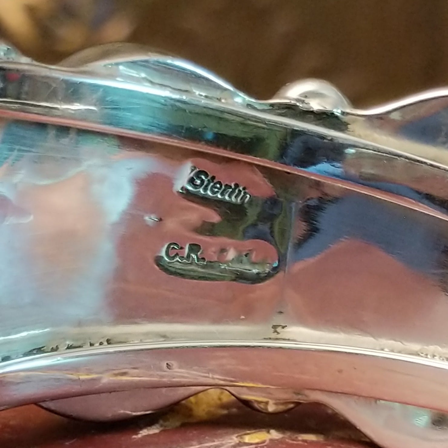 Close-up of the artisans stamped signatures.