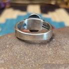 Sterling silver ring with Sonoran gold turquoise set in a raised, oval bezel and brushed finish.
