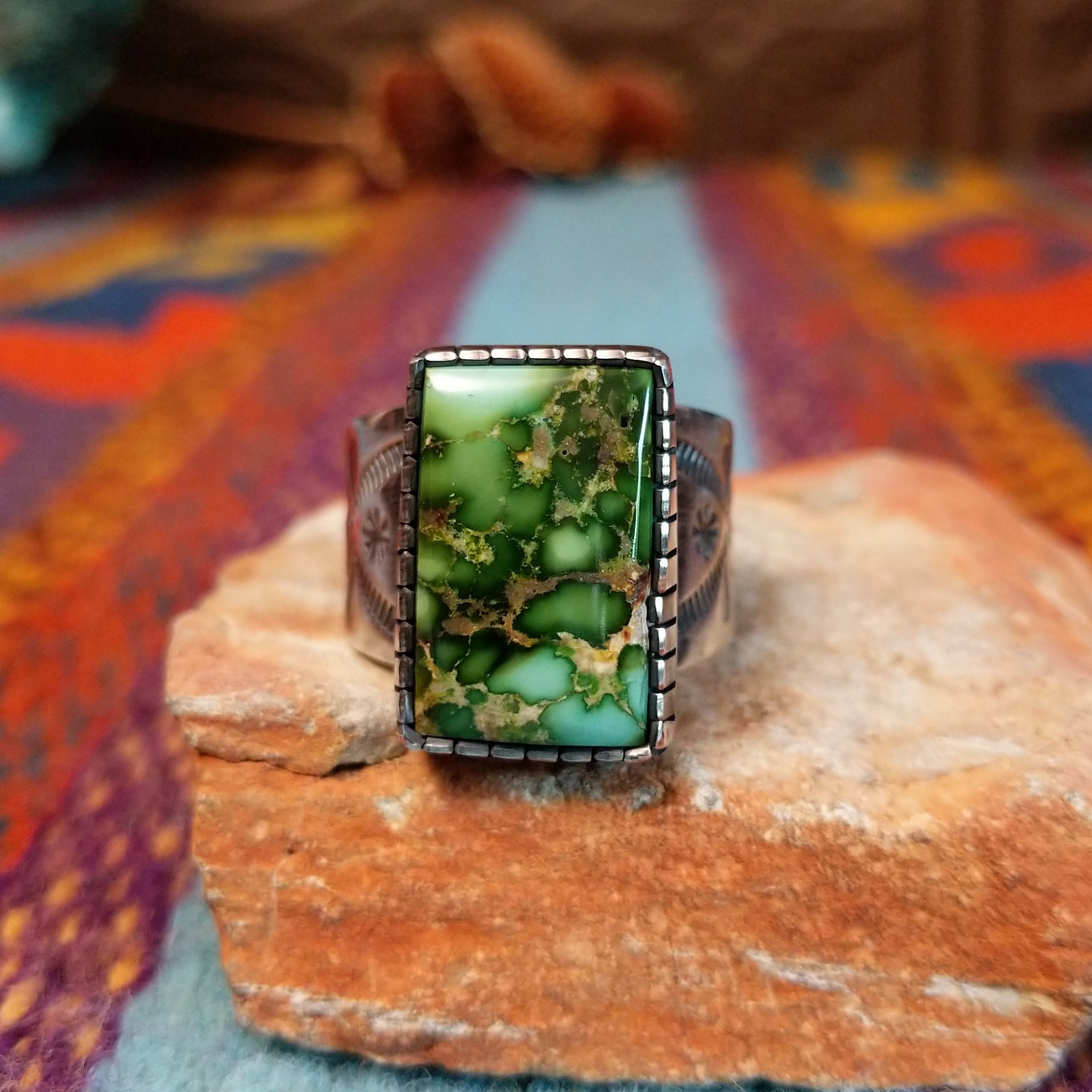 Sonoran Gold Turquoise Ring by Murphy Platero with a rectangular stone and stamped silver band.