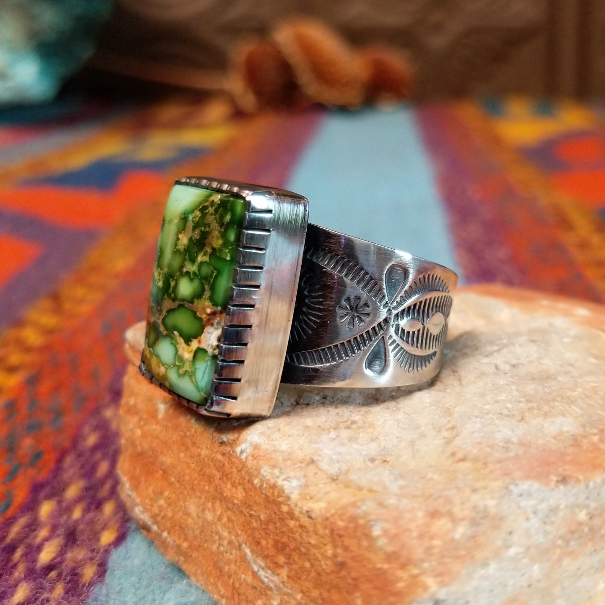 Sonoran Gold Turquoise Ring by Murphy Platero with a rectangular stone and stamped silver band.