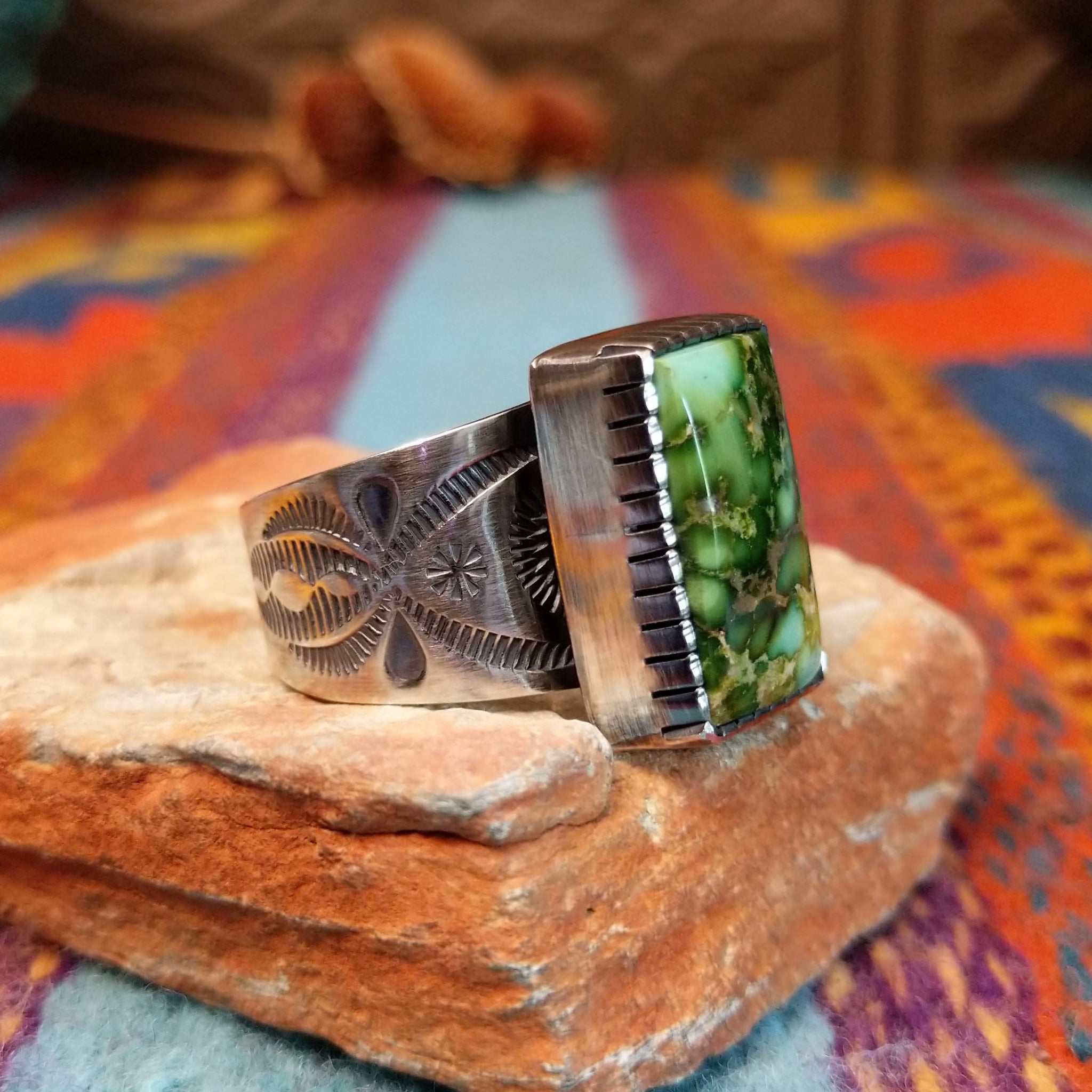 Sonoran Gold Turquoise Ring by Murphy Platero with a rectangular stone and stamped silver band.