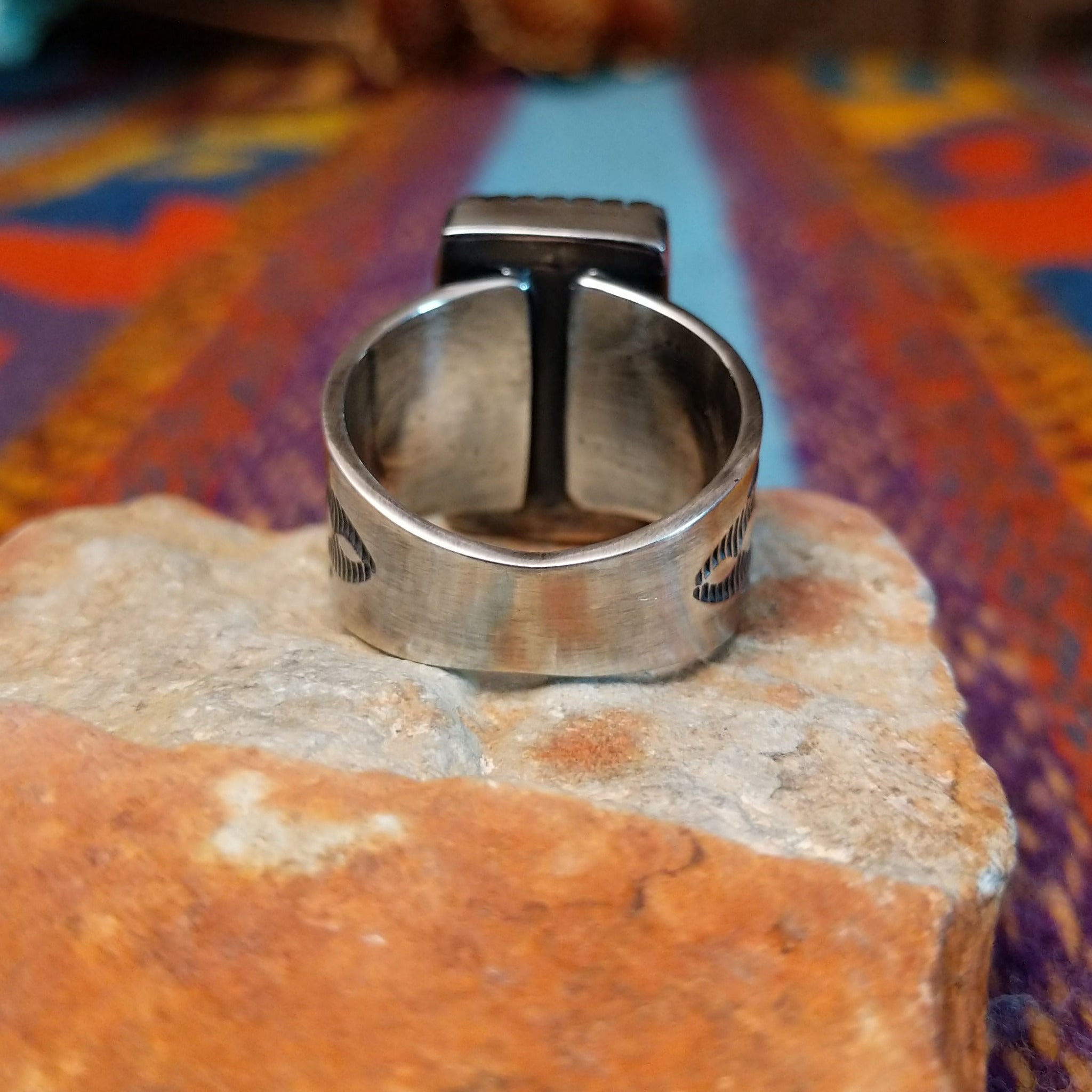 Sonoran Gold Turquoise Ring by Murphy Platero with a rectangular stone and stamped silver band.
