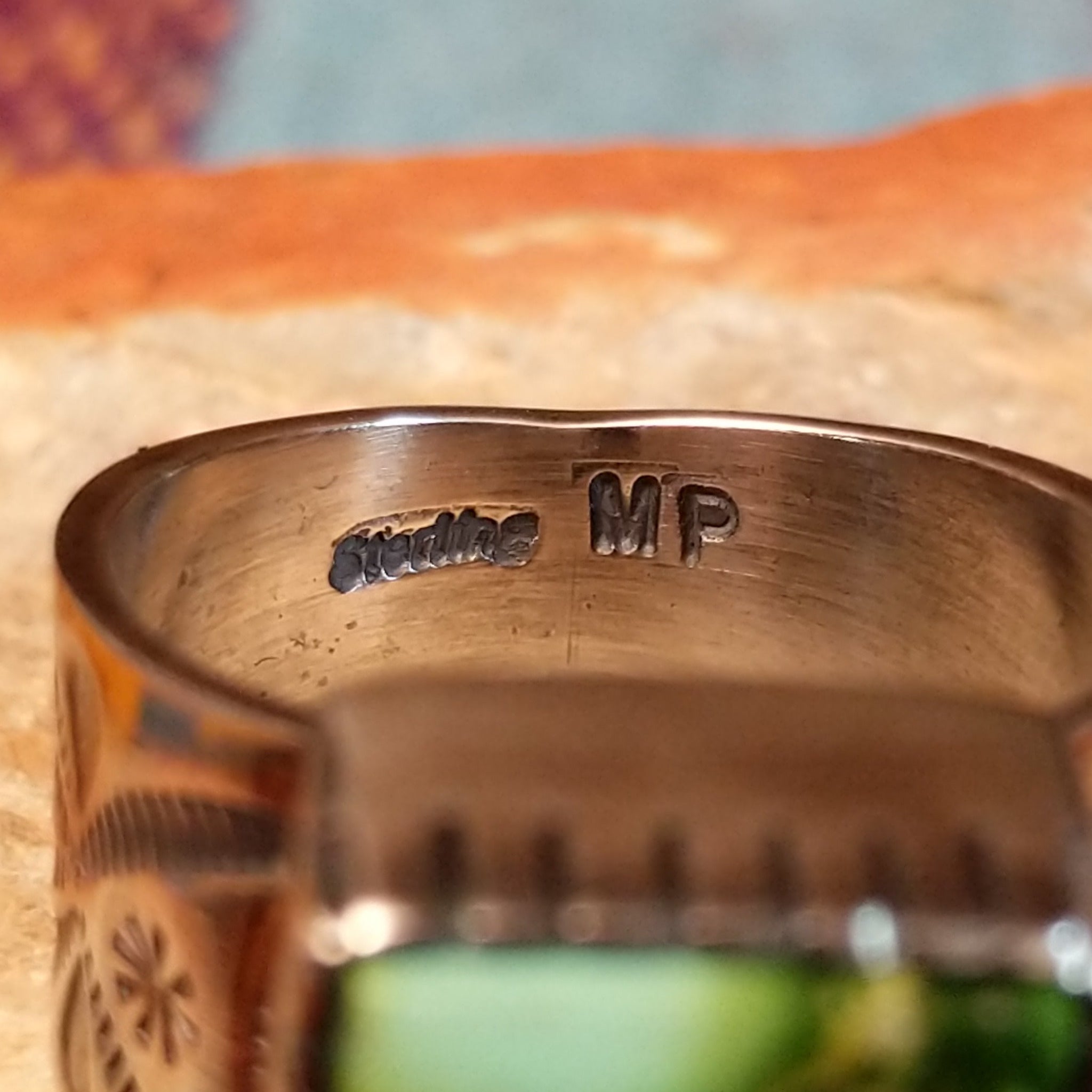 Close up of the artist's stamped signature