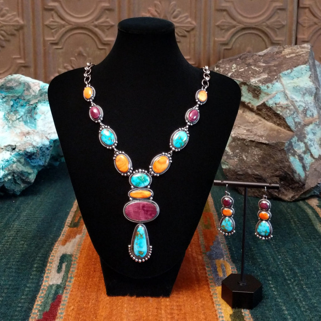 Patterned Sonoran gold turquoise and spiny oyster shell set in sterling silver with intricate dotted accents.