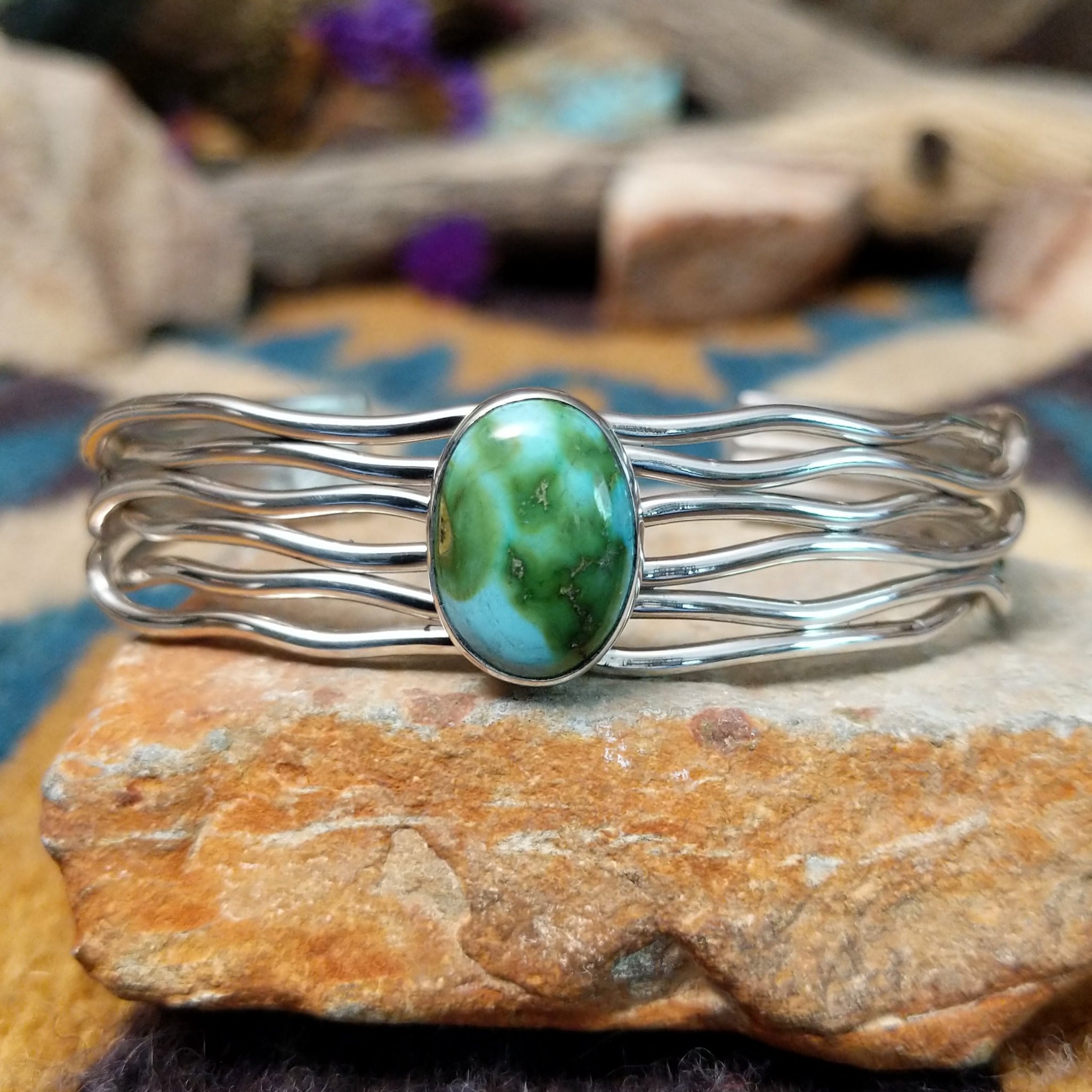 Handcrafted Navajo sterling silver five-strand cuff by Murphy Platero featuring an oval Sonoran Gold turquoise cabochon in a flowing open-wire design.