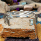 Handcrafted Navajo sterling silver five-strand cuff by Murphy Platero featuring an oval Sonoran Gold turquoise cabochon in a flowing open-wire design; underside view.