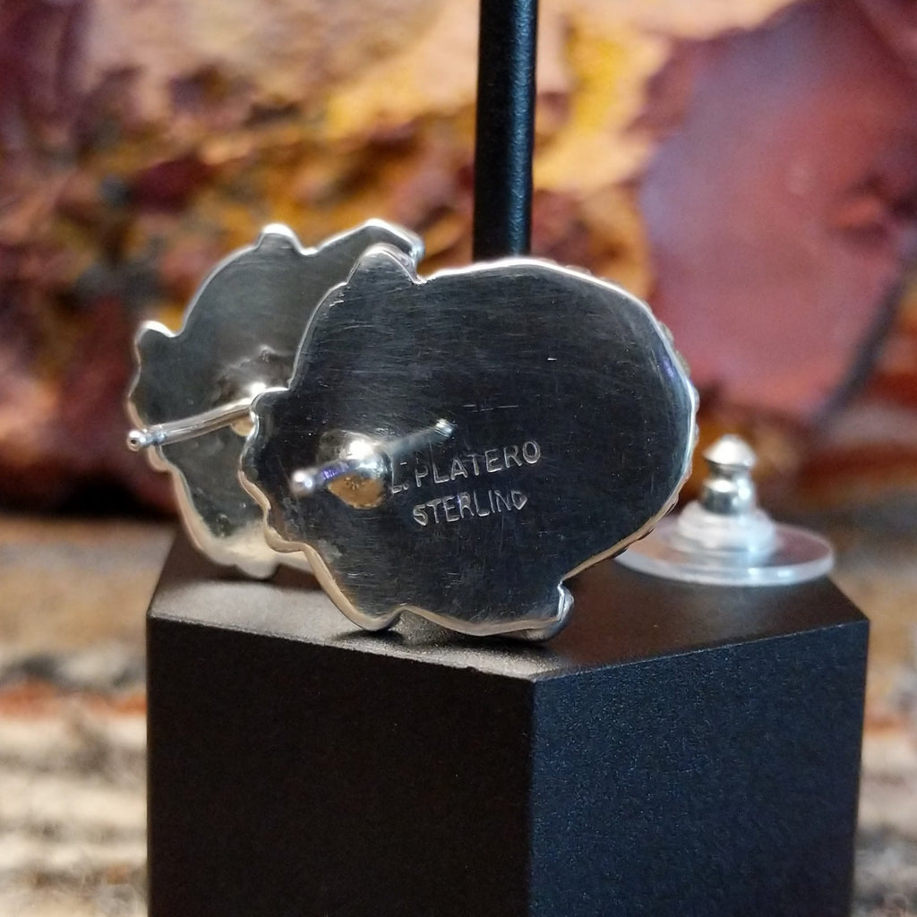 Close-up of the artisan's stamped signature.