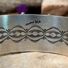 Handcrafted Navajo sterling silver cuff by Murphy Platero featuring a rectangular Sonoran Mountain turquoise cabochon with a twisted rope bezel, repoussé conchos, hand-stamped details, and polished silver accents; artisan and Sterling Silver stamp.
