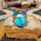 Sterling silver Sonoran Mountain Turquoise ring by Angela Martin with an oval sky-blue gemstone and natural golden matrix.