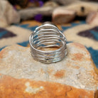 Sterling silver Sonoran Mountain Turquoise ring by Angela Martin with an oval sky-blue gemstone and natural golden matrix; underside view.