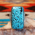 Sterling silver ring with Spiderweb Kingman turquoise set in a rectangular bezel.