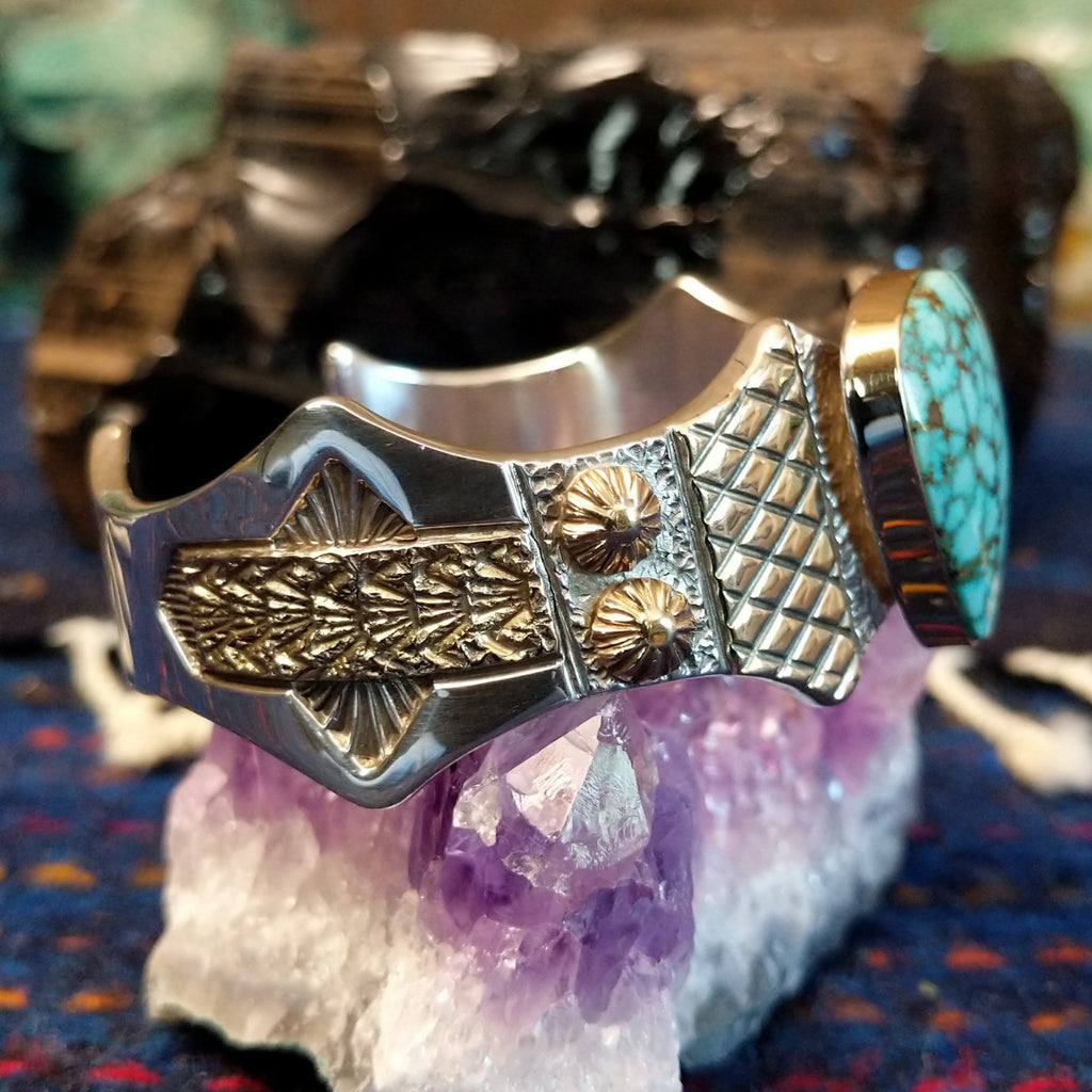 The intricate stamping on the side of the cuff.