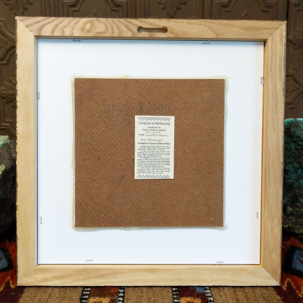 The back features the artisan's authentication tag.