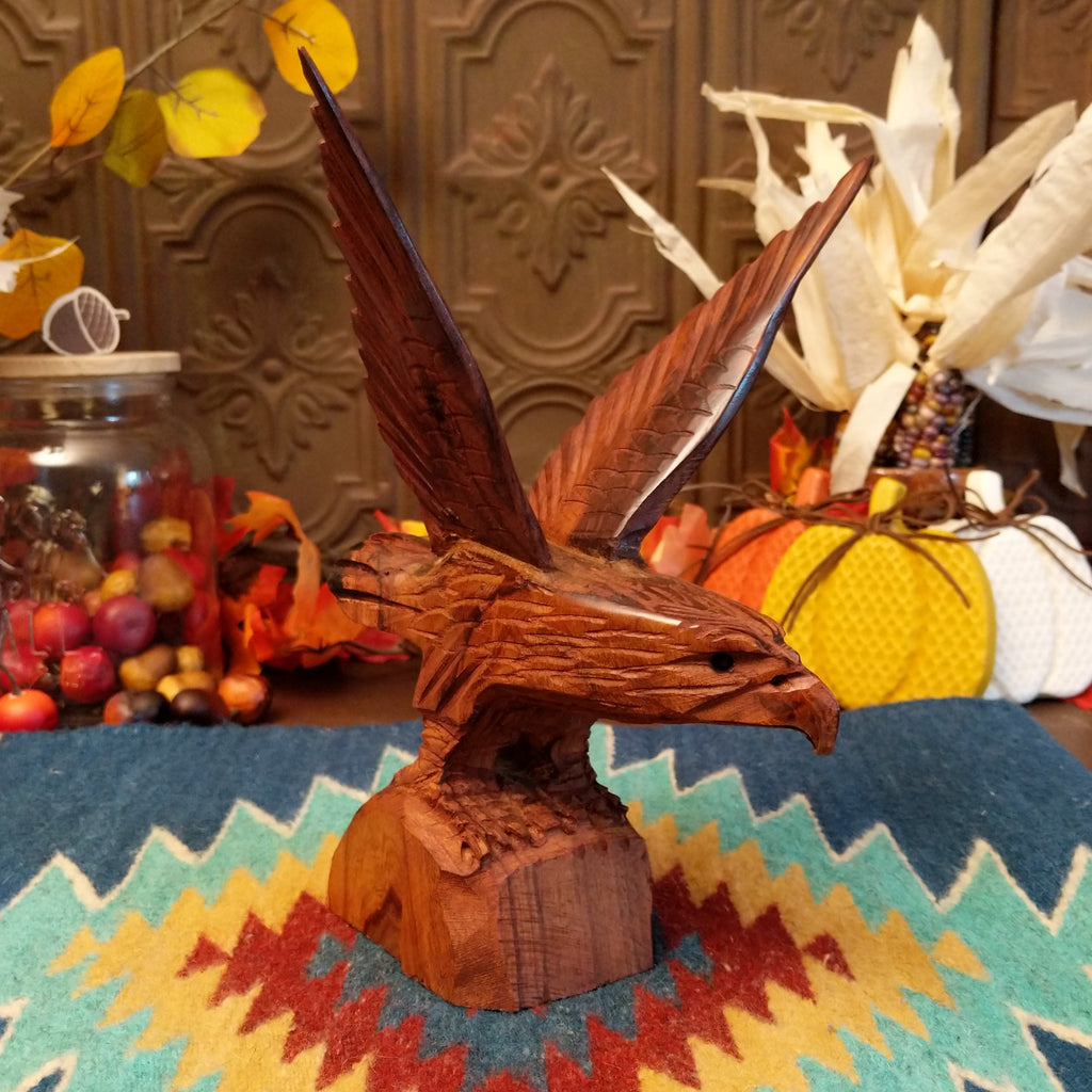 Ironwood carved into a detailed eagle taking flight.
