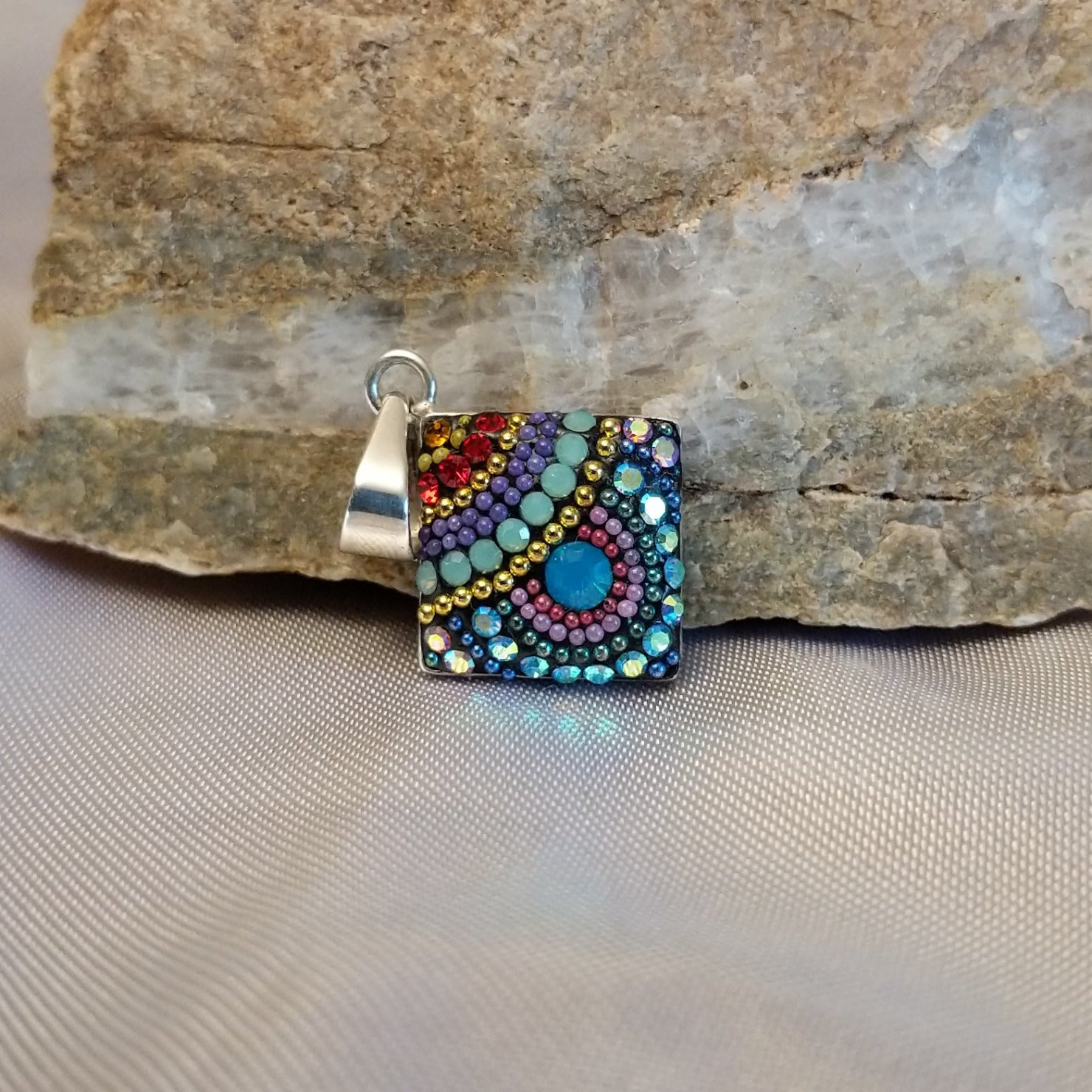 Sterling silver square pendant with Austrian crystals.