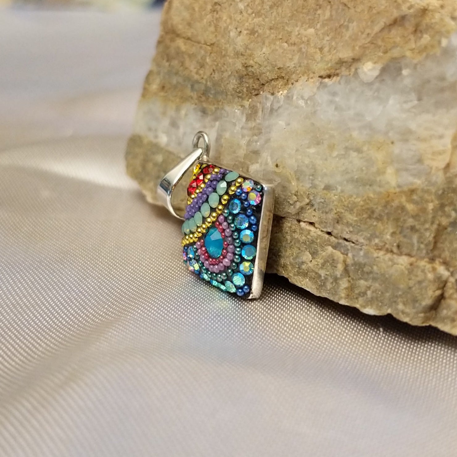 Sterling silver square pendant with Austrian crystals.