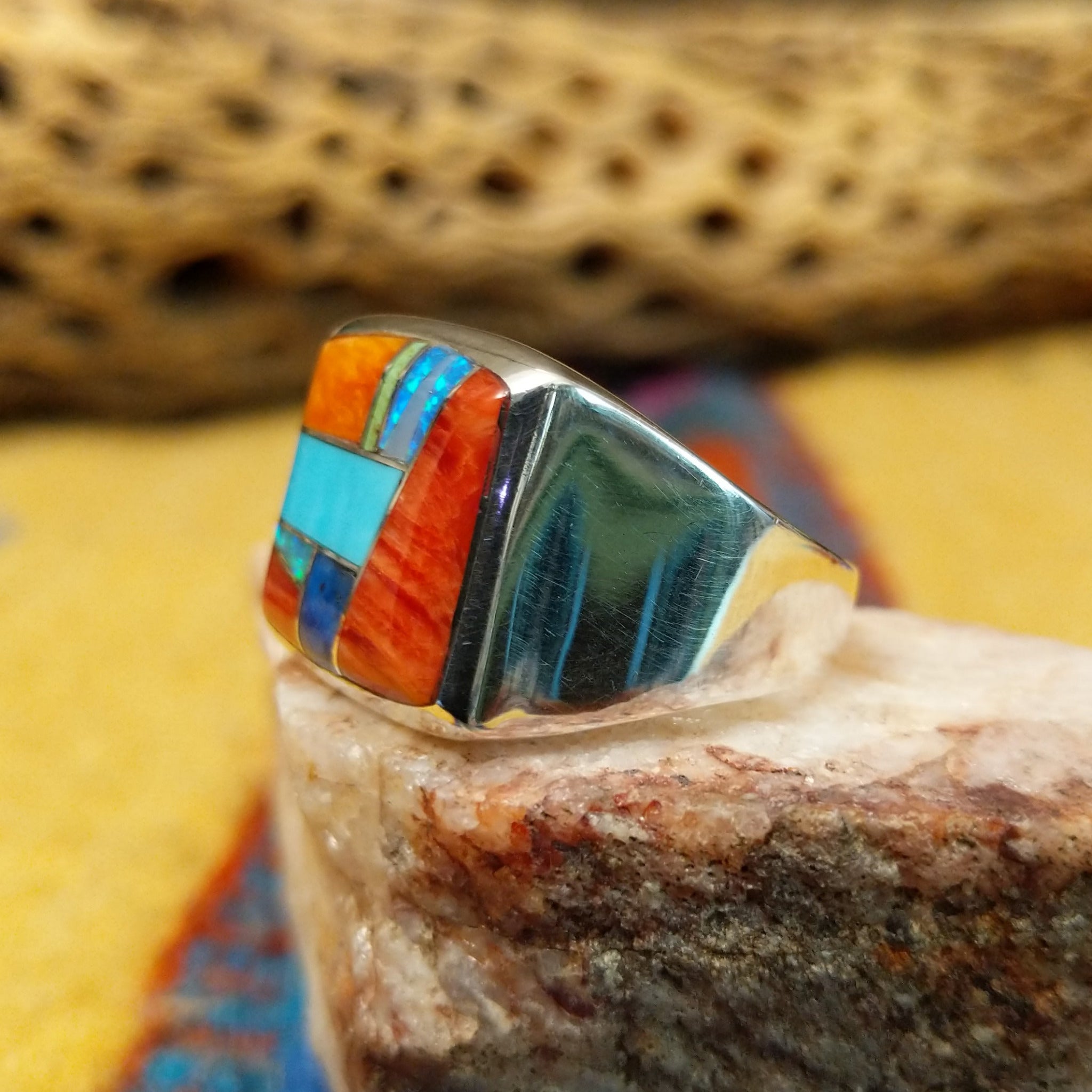 Square multistone inlay ring by Bernadine Joe, featuring a geometric arrangement of natural stones set in a handcrafted sterling silver band with traditional Southwestern-inspired craftsmanship.  Side view.