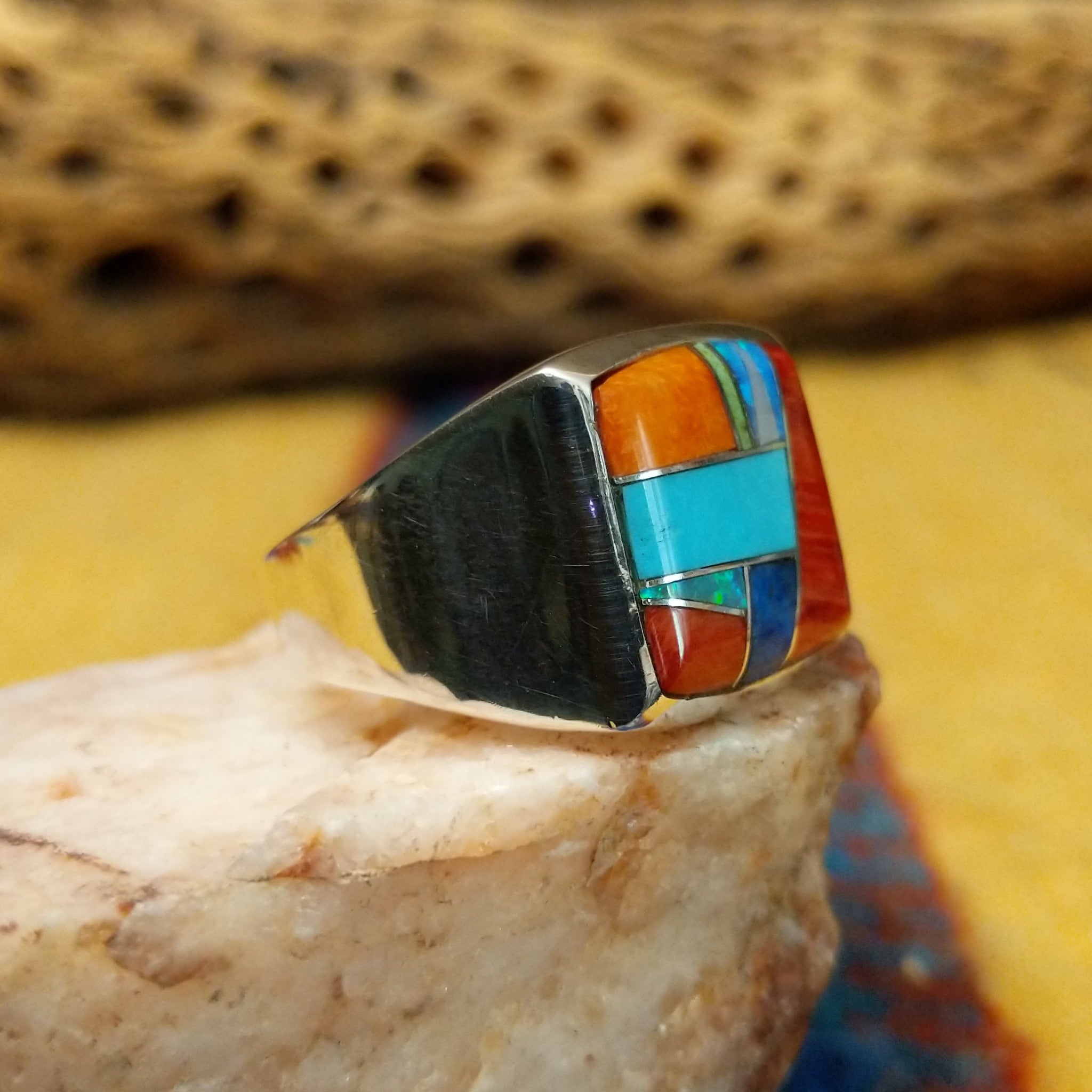 Square multistone inlay ring by Bernadine Joe, featuring a geometric arrangement of natural stones set in a handcrafted sterling silver band with traditional Southwestern-inspired craftsmanship.  Side view.