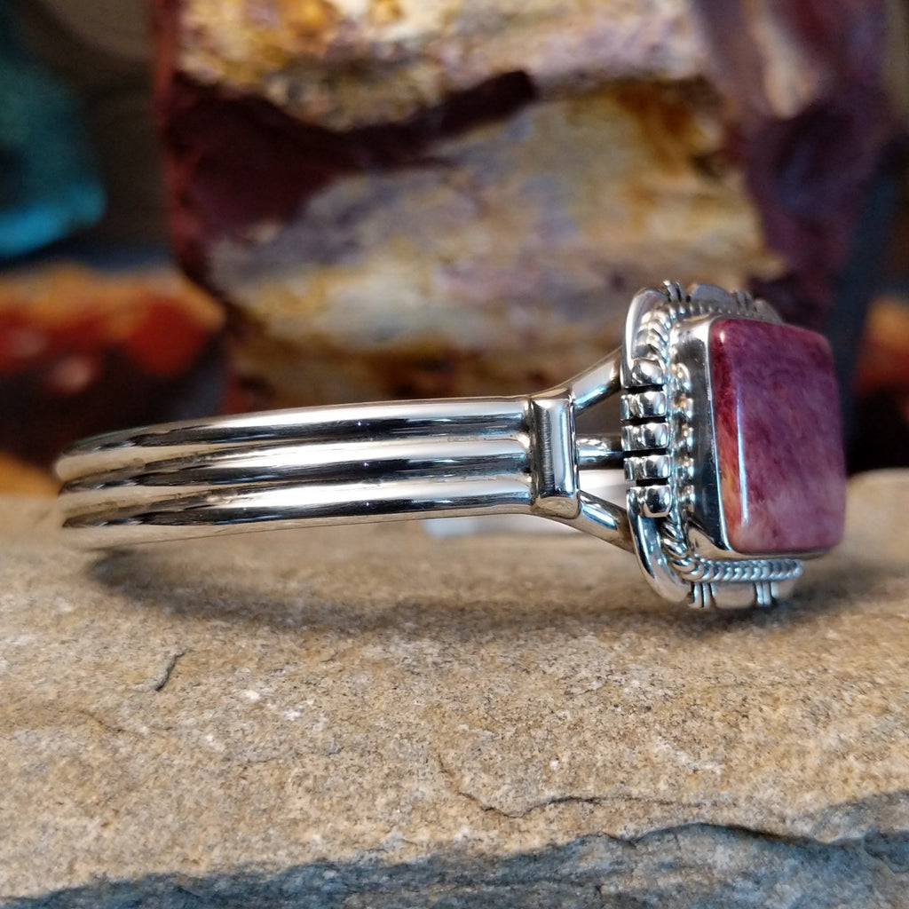 Square purple spiny oyster shell cuff in sterling silver with twisted rope detailing on the bezel.