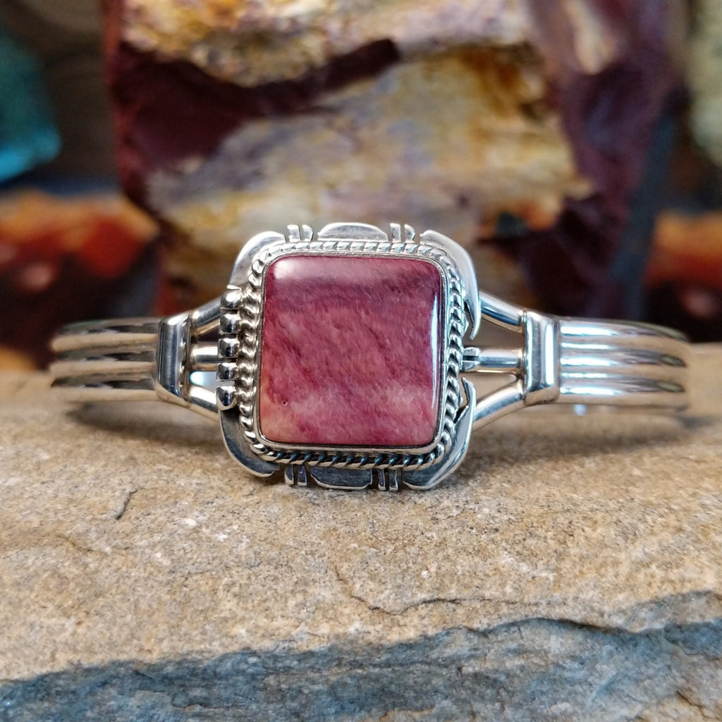 Square purple spiny oyster shell cuff in sterling silver with twisted rope detailing on the bezel.