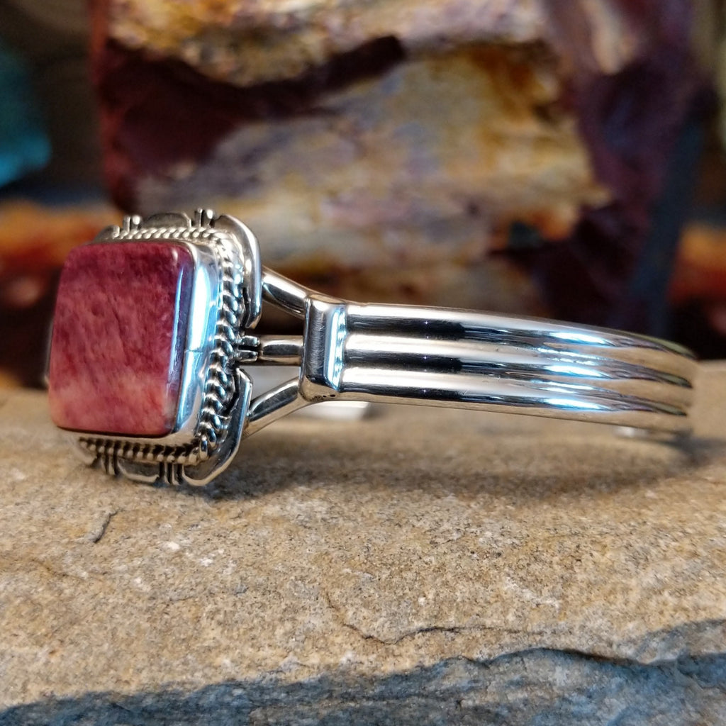 Square purple spiny oyster shell cuff in sterling silver with twisted rope detailing on the bezel.