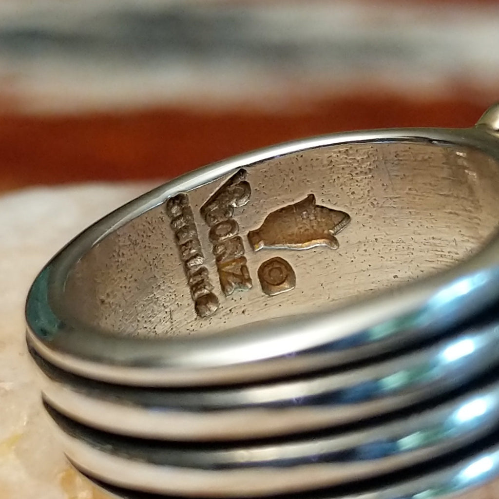 The artisan's stamped signature.