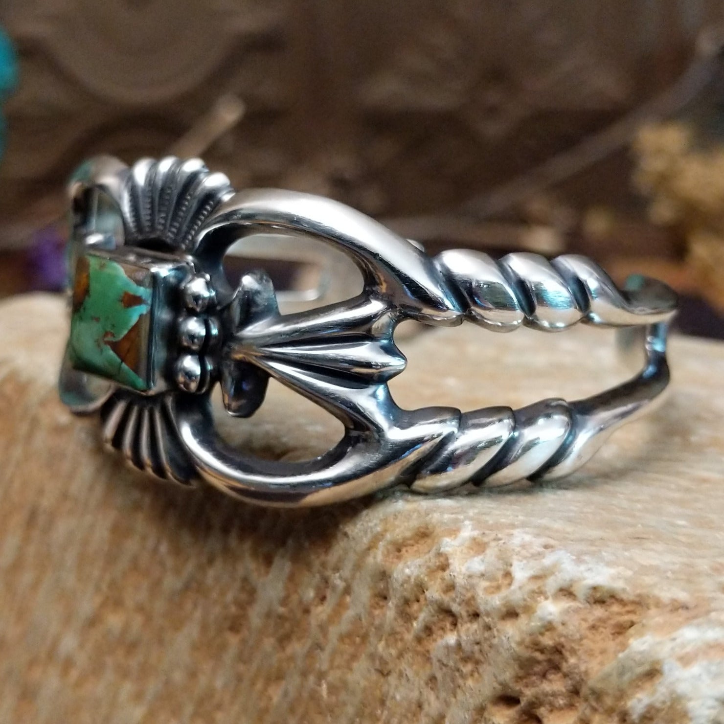 Sterling silver cuff with Royston turquoise set in a square bezel and ornate silverwork band.