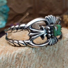 Sterling silver cuff with Royston turquoise set in a square bezel and ornate silverwork band.