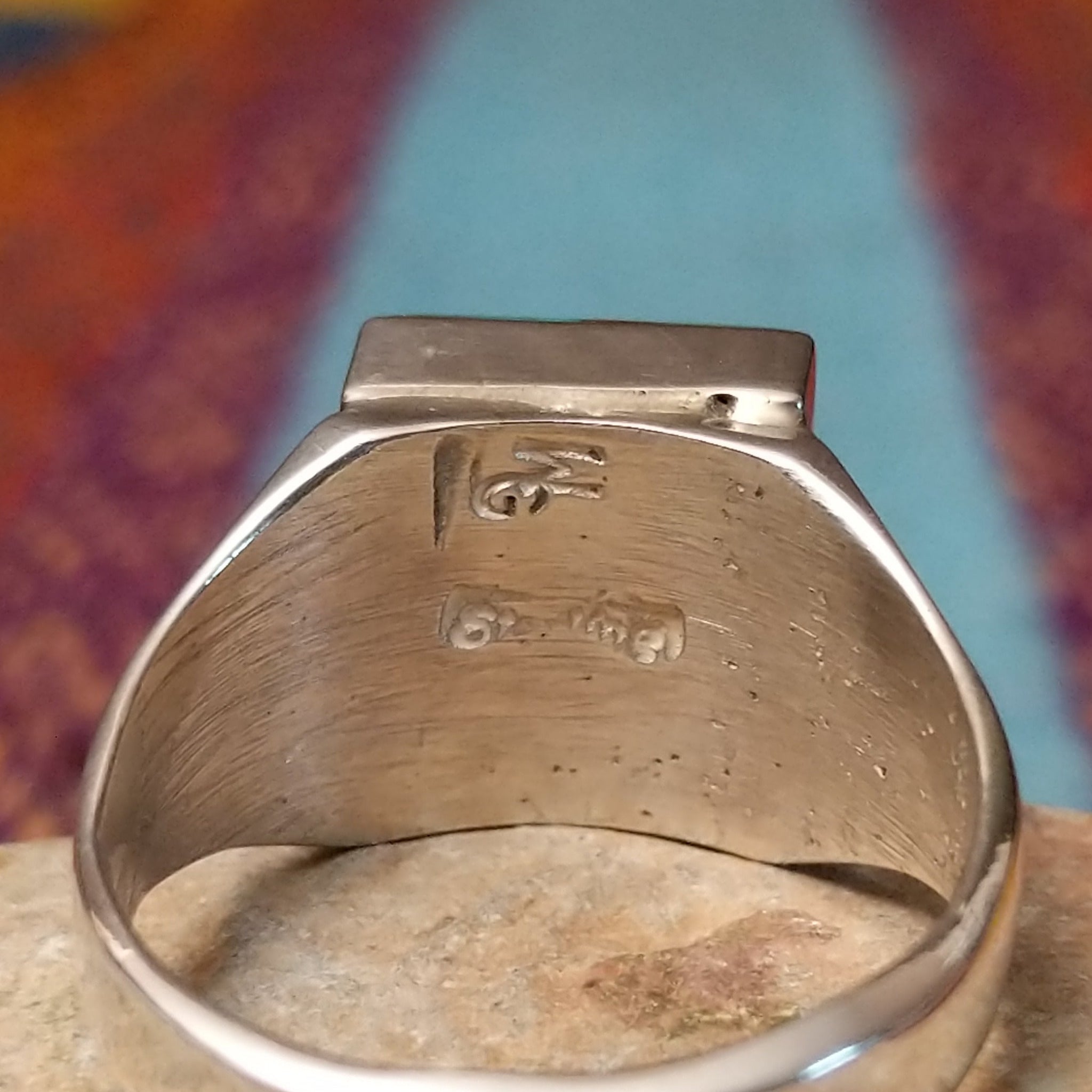 Square Turquoise Inlay Ring by Wilbert Grey featuring geometric turquoise inlay with natural brown matrix, separated by Sterling Silver channels and set on a polished silver band; artisan and Sterling Silver stamp.