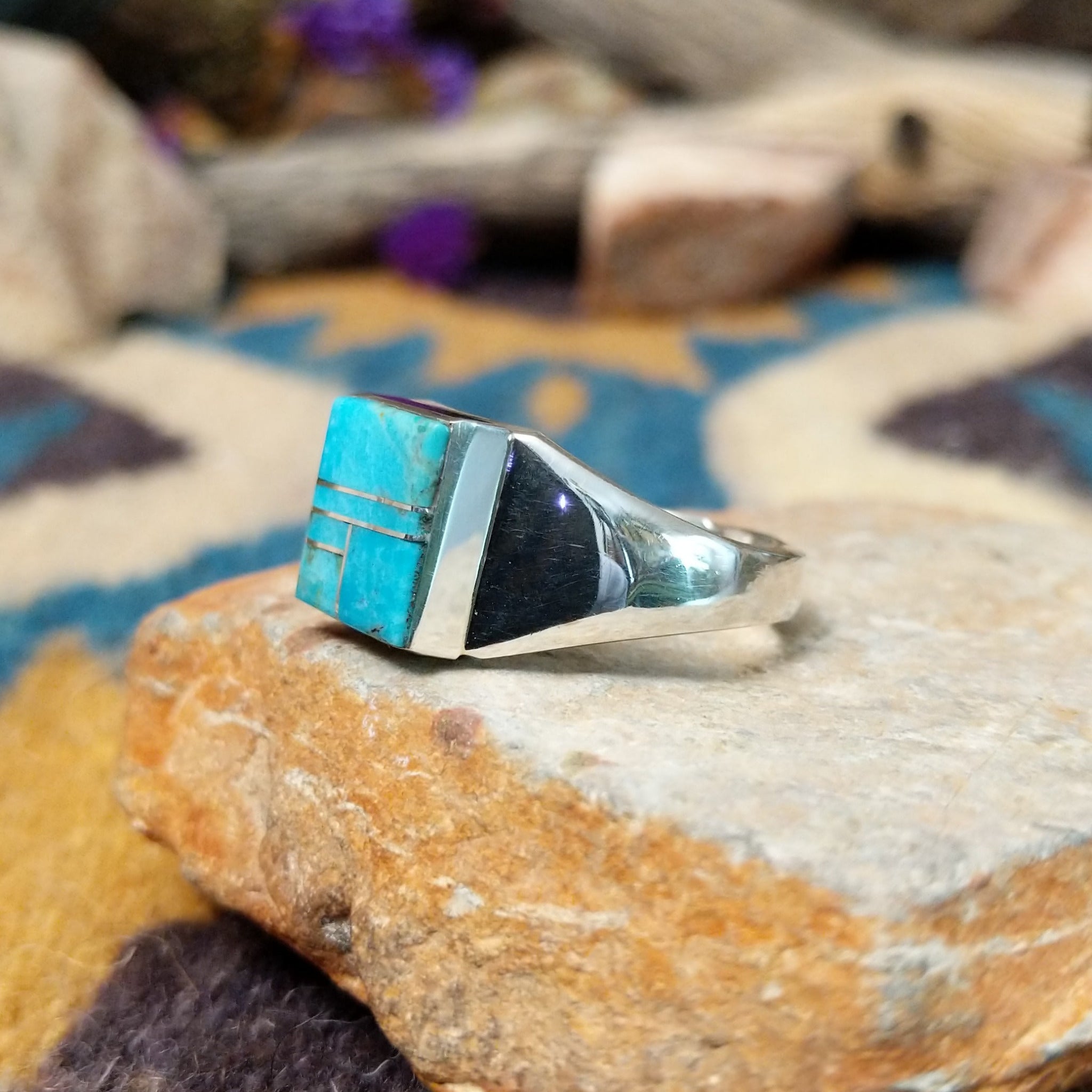Sterling silver square Turquoise inlay ring by Wilbert Grey with geometric silver accents; side view.