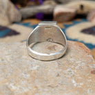 Sterling silver square Turquoise inlay ring by Wilbert Grey with geometric silver accents; underside view.