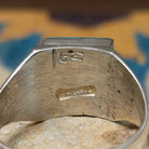 Handcrafted Navajo sterling silver ring by Wilbert Grey featuring a square turquoise inlay with sterling silver channel accents in a polished geometric setting; artisan and Sterling Silver stamp.