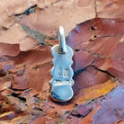 The back features the artisan's stamped signature.