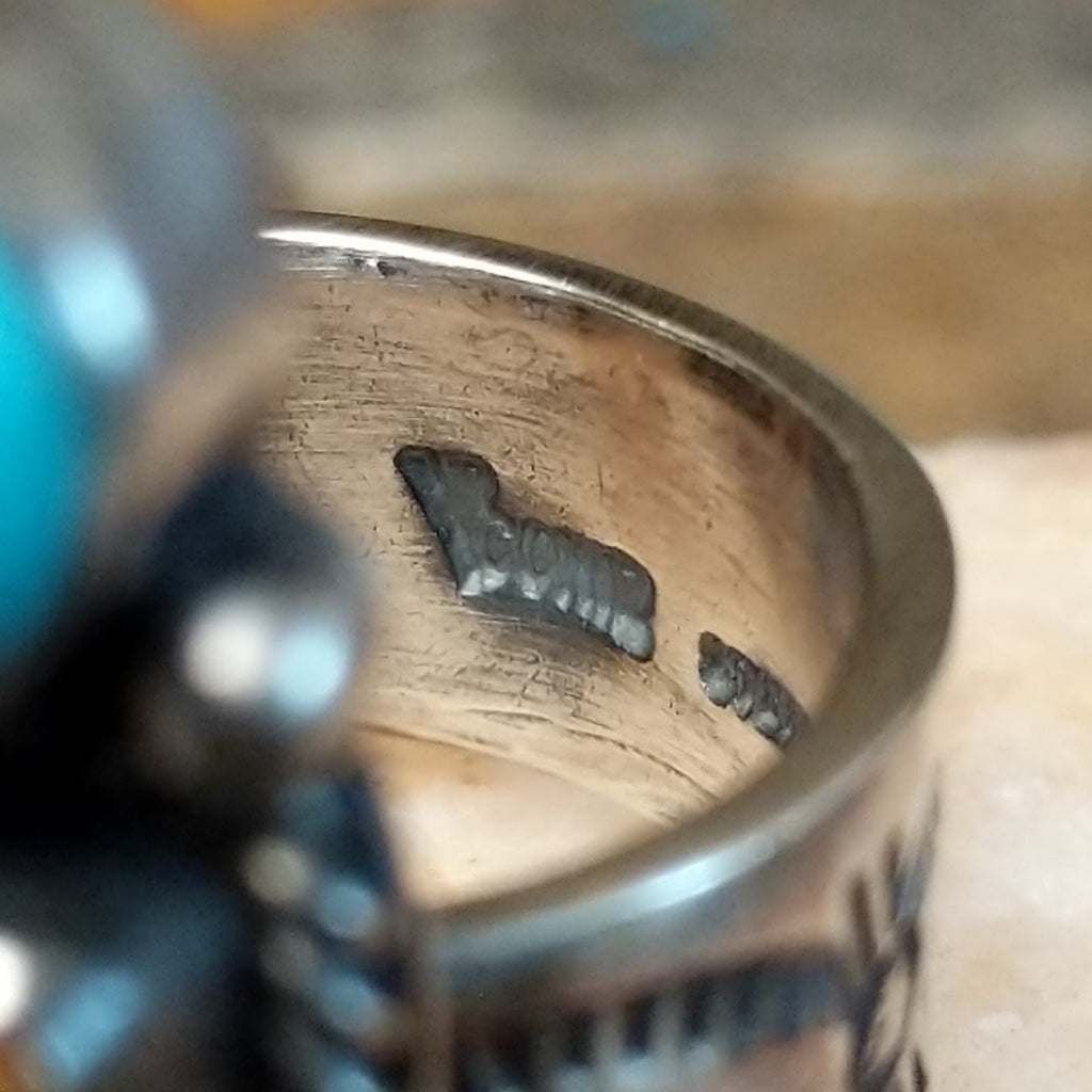 Close-up of Raymond Coriz's stamped signature.