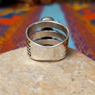 Stacked Turquoise Ring by Raymond Coriz featuring three oval turquoise stones set across three Sterling Silver bands with polished silver beads and hand-stamped detailing; underside view.