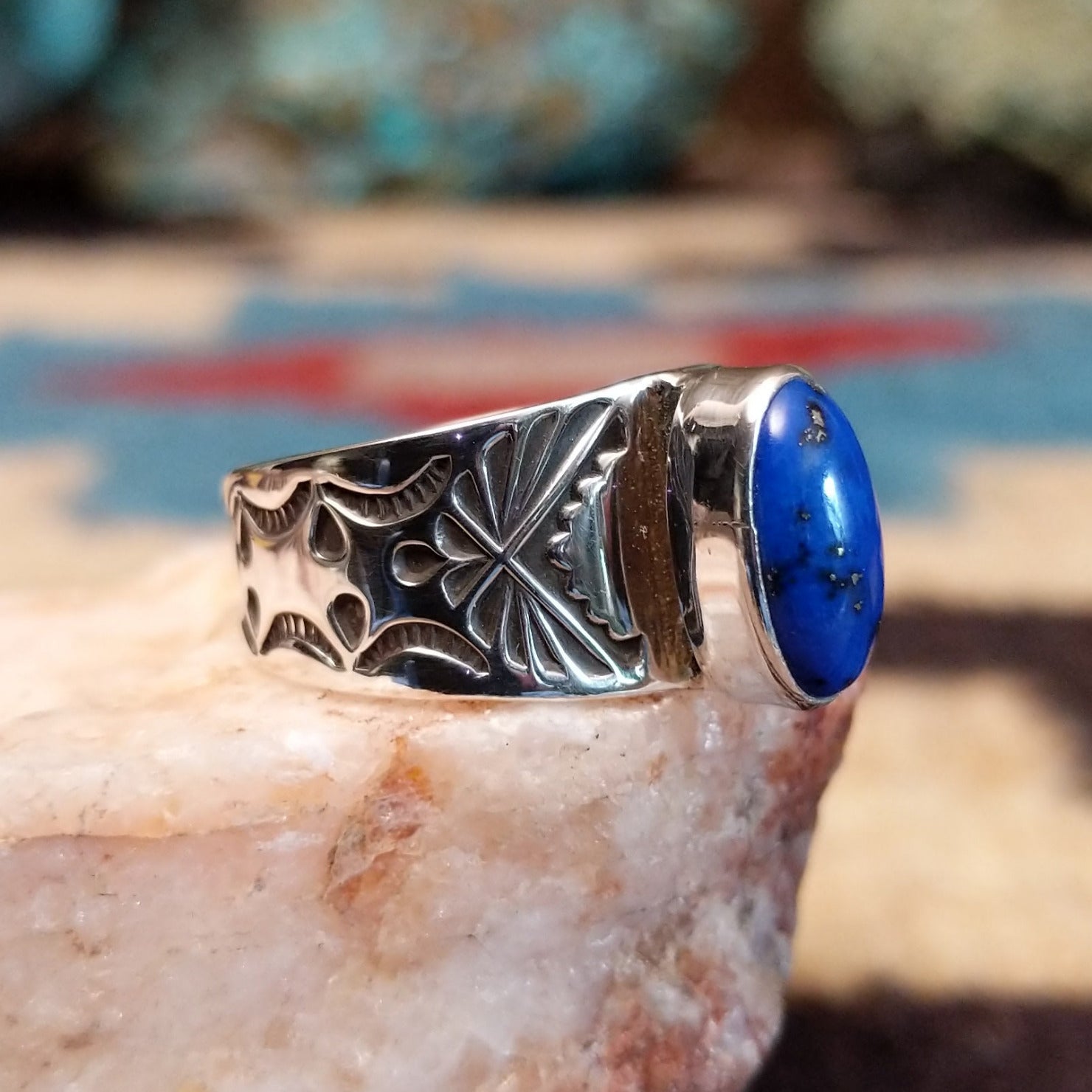 Sterling silver Navajo ring with lapis set in polished oval bezel.