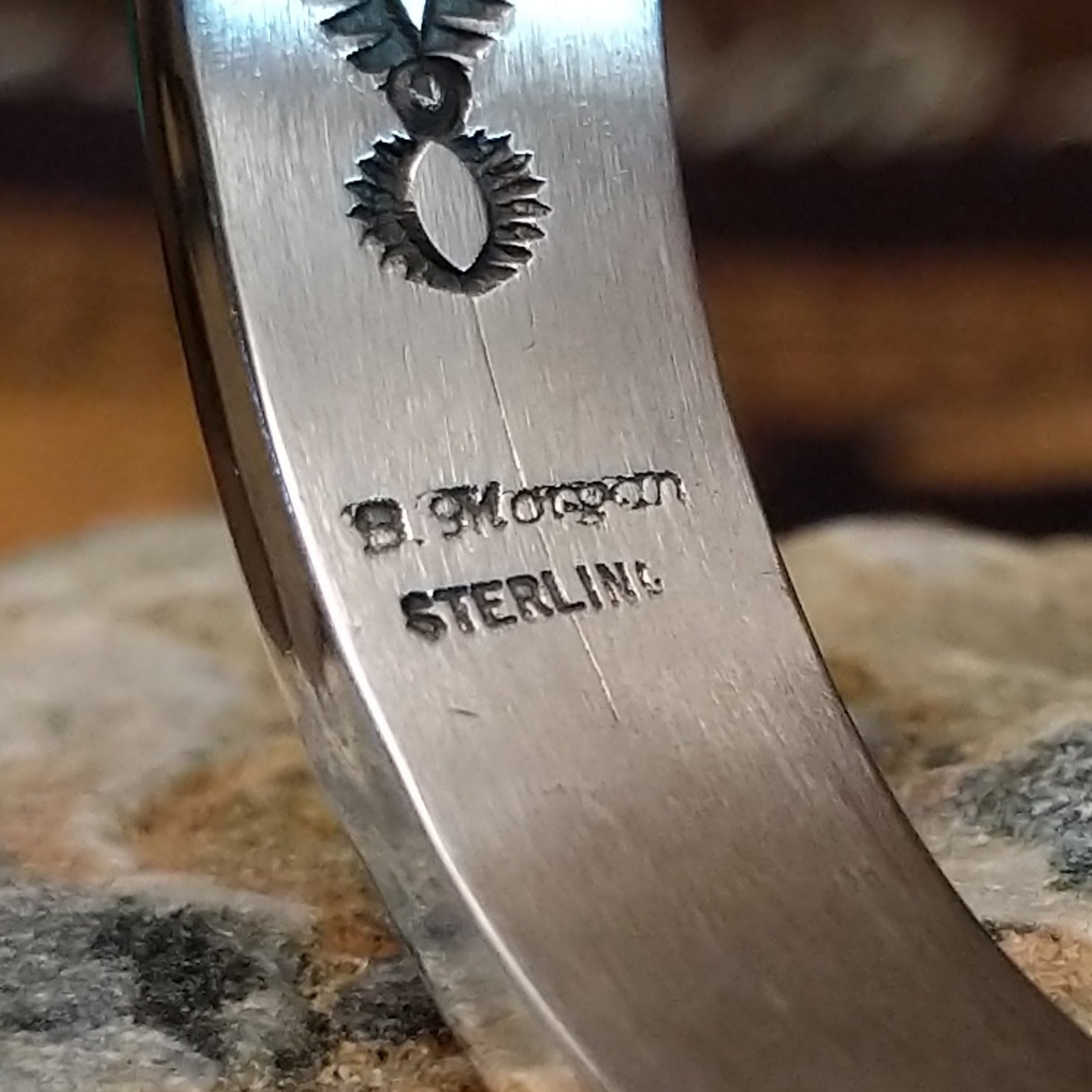 Close up of the artist's stamped signature.