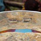 Close up of the artist's stamped signature
