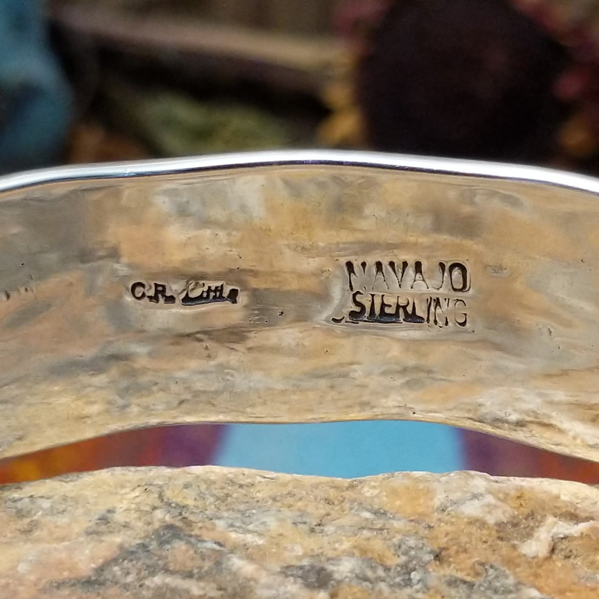 Close up of the artist's stamped signature