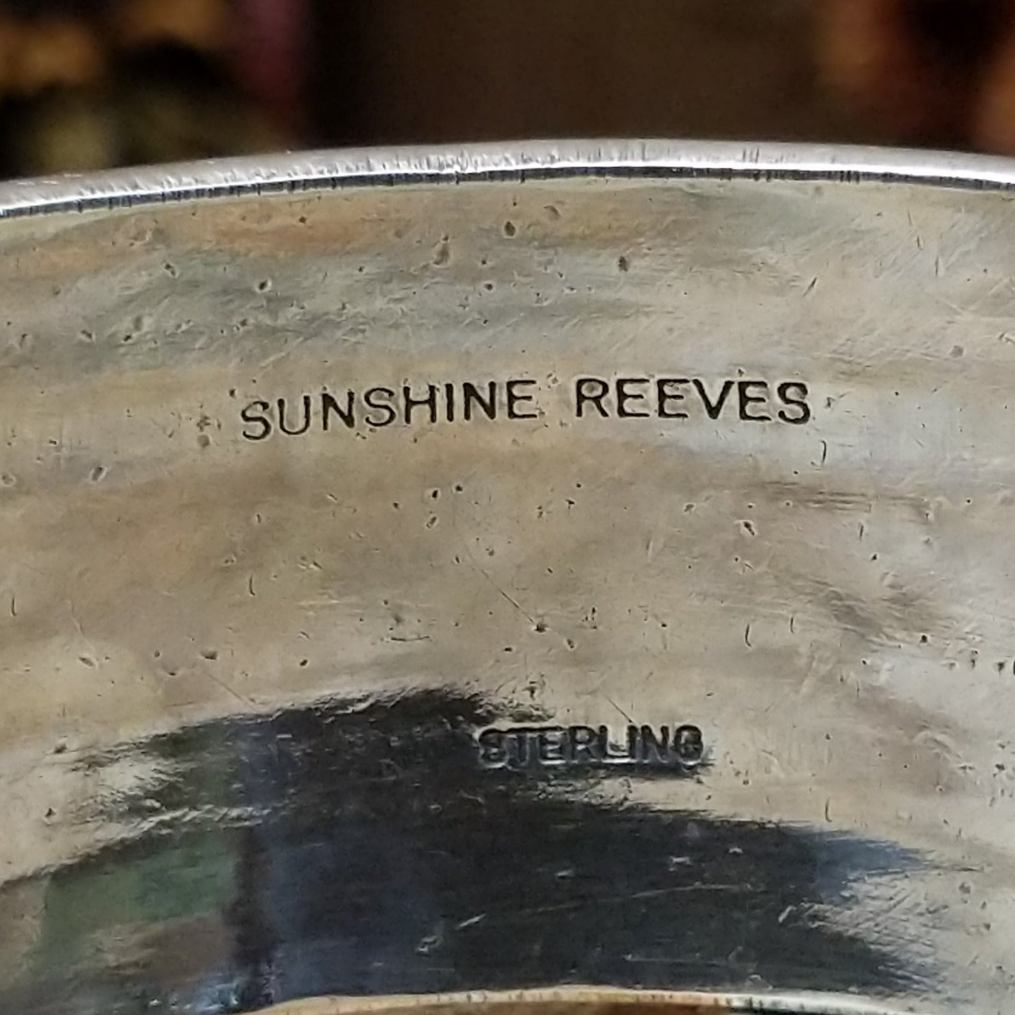 Close up of the artist's stamped signature.