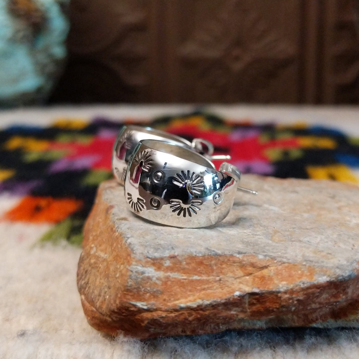 Stamped silver hoop earrings by Angela Martin.
