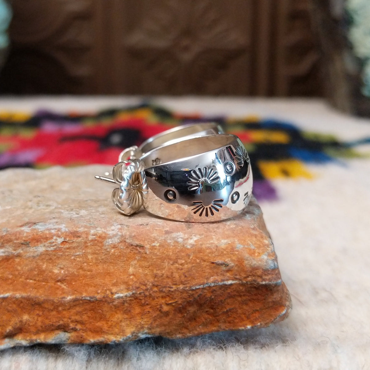 Stamped silver hoop earrings by Angela Martin.