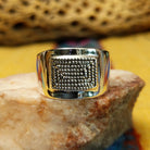 Stamped sterling silver ring by Raymond Coriz, featuring intricate hand-stamped patterns on a polished sterling silver band with traditional Southwestern-inspired craftsmanship.