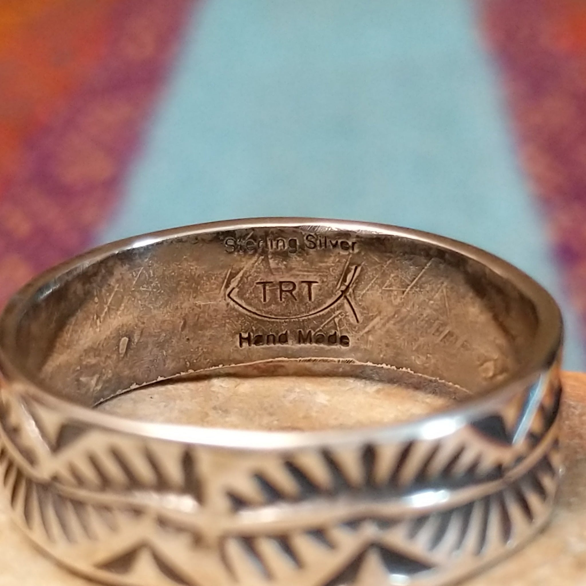 Close up of the artist's stamped signature