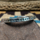 Starred sterling silver cuff by Sunshine Reeves, featuring hand-stamped star motifs and intricate geometric patterns on a handcrafted open sterling silver cuff.