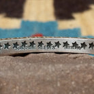 Starred sterling silver cuff by Sunshine Reeves, featuring hand-stamped star motifs and intricate geometric patterns on a handcrafted open sterling silver cuff.  Artisan and Sterling Silver stamp.