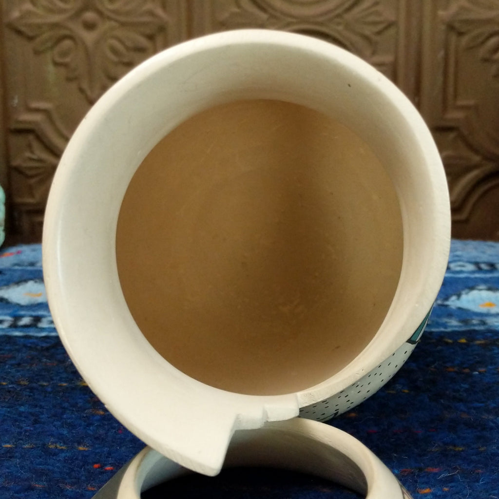 The inside is hollow and showcases the smooth stepped rim.